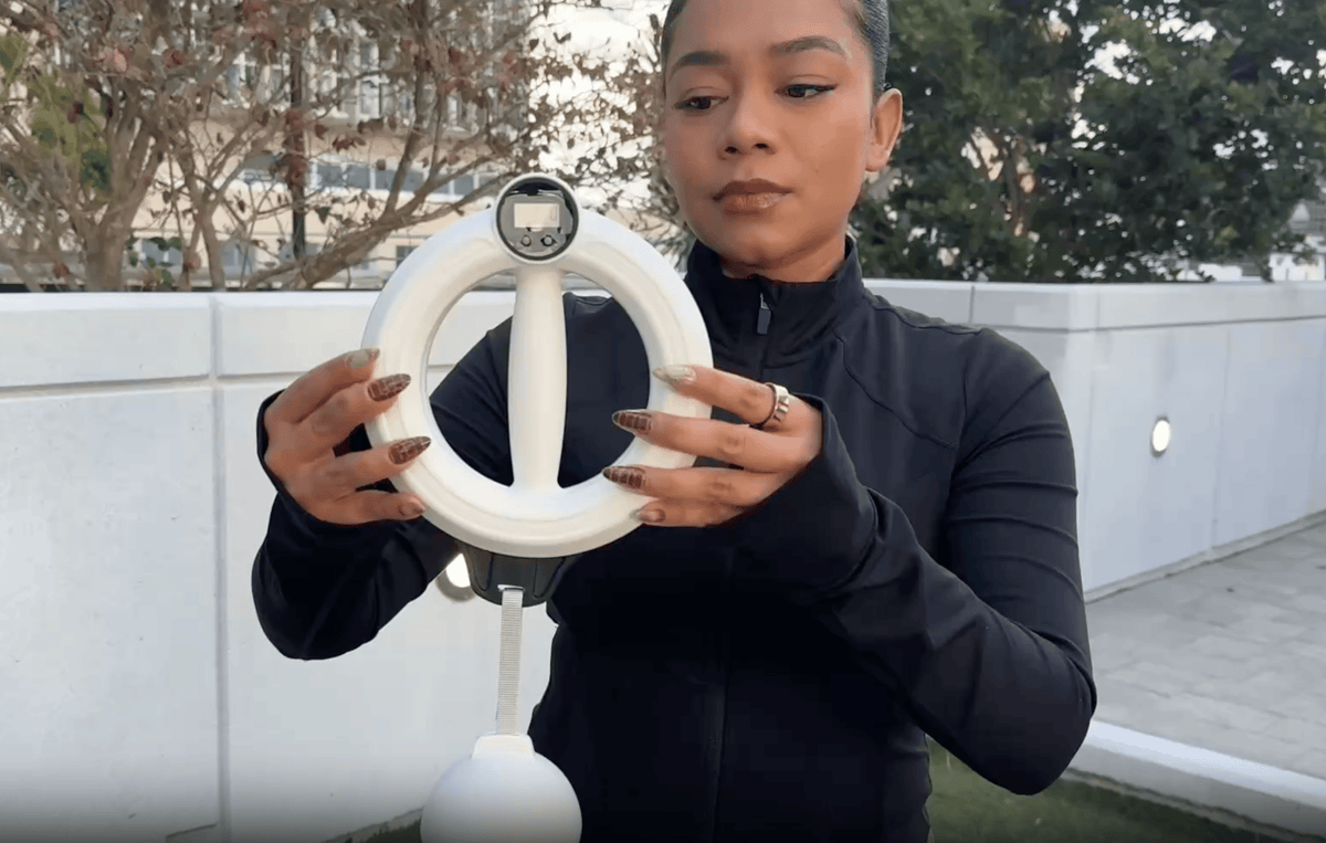 Woman using the Infinity Arm Hoop